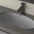 Modern Oval Wash Basin With Black Faucet On Grey Stone Countertop