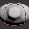 Fashionable Red Beaded Necklace on White Mannequin with Chain Details
