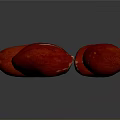Four Ripe Red Fruits with Textured Surfaces on Dark Background