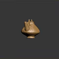 Golden Teapot Shaped Sculpture with Intricate Patterns and Decorative Handles on Stable Base