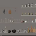 Organized Kitchen Utensils Storage On Shelves With Towels Cutting Boards Jars Glassware Pots And Knives