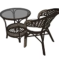 Outdoor Rattan Table and Chair Set Featuring Round Glass Top and Wicker Armchair Design