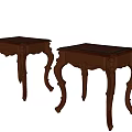 Two Ornate Wooden Side Tables With Carved Details And Curved Legs