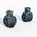 Two Black Hexagonal Jars With Intricate Carved Patterns On White Background