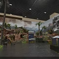 Historical Military Exhibition Hall Interior With Vintage Cannon Sandbags Murals Green Plants And Benches