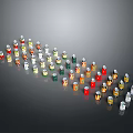 Colorful Small Food Seasoning Bottles in Various Sizes Arranged in Wave Pattern on Gray Background