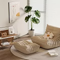 Beige Bean Bag Chair with Ottoman on Round Rug and Monstera Plant in White Planter
