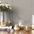 Transparent Glass Vases With White Flowers And Golden Bases On Wooden Tabletop Against Gray Wall