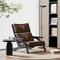 Brown Leather Leisure Chair With Black Frame Side Table Books Floor Lamp And Plant