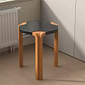 Modern Stool With Black Hexagonal Top And Wooden Legs In Room Corner On Wooden Floor