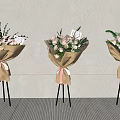 Floral Display With Paper Wrapped Bouquets Pink Ribbons And Tripod Stands