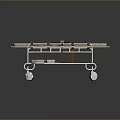 Medical Stretcher With Wheels Brown Straps And Red Item On Mattress