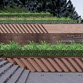 Layered Retaining Wall With Green Grass Cover And Brick Design Near Stone Stairs And Trees