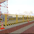 Construction Site With Yellow Safety Barriers Orange Traffic Cones Excavators And Cranes Under Blue Sky