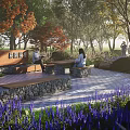 Park Landscape Featuring Colorful Trees Stone Tables Benches And Purple Flowers