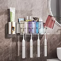 Bathroom Wall Mounted Organizer Shelf With Electric Toothbrushes Storage Cups And Skincare Products