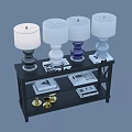 Decorative Ornament Set With Colorful Table Lamps Gold Candle Holders And Books On Black Shelf