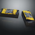 Two Black Boxes With Yellow Gray Textured Lids And Stylish Surface Patterns