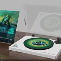 Modern Turntable With Green Vinyl Record Transparent Cover And Music Album On Wooden Desk