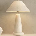 Minimalist Textured Base Table Lamp with Beige Fabric Shade on Shelf and Potted Plant