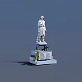 White Soldier Statue On Monument Base With Inscriptions And Flowers