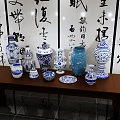 Traditional Chinese Calligraphy Art with Blue and White Porcelain on Wooden Table