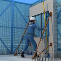 Construction Site Worker Measuring Concrete Wall With Level Tool And Safety Scaffolding