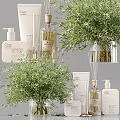 Stylish Bathroom Accessories Setup With Green Plants And Toiletry Bottles