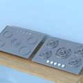 Modern Kitchen Appliances Including Electric Cooktop And Gas Hob On Wooden Countertop