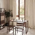 Serene Traditional Tea Room With Wooden Table Chairs Screen And Green Plant View