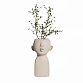 Face Shaped Ceramic Vase with Ivory Color and Green Branches for Interior Decor