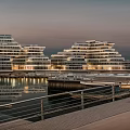 Layered Modern Waterfront Building Complex With Twilight Reflections And Architectural Design