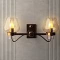 Modern Decorative Wall Lamp With Transparent Glass Shades Brass Base On Gray Striped Wall
