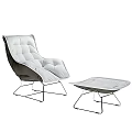 Modern White Padded Massage Chair With Ottoman And Metal Frame Design