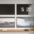 Four Wall Mounted TVs Displaying Car And Landscape Images In Home Setup