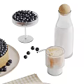 Delicious Blueberry Cheesecake Topped With Blueberries Served With Milk Bottle Glass Fork Knife And Plates