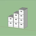 Modern White Storage Cabinets With Multiple Drawers Against Blue Wall On Black Floor