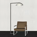 Modern Floor Lamp With Brown Leather Chair Against White Wall And Gray Floor