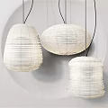 Modern White Woven Pendant Lights With Different Shapes Hanging From Ceiling In Interior