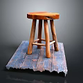 Rustic Wooden Stool With Round Seat On Blue Wooden Plank Base