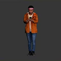 Man in Orange Jacket With Bandana Holding Phone Against Gray Background