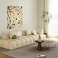 Modern Beige Sofa and Round Coffee Table Set With Decorative Pillows and Abstract Wall Art