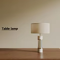 Modern Table Lamp with White Lampshade on Wooden Table Against Beige Background Wall