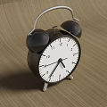 Black Double Bell Alarm Clock With White Dial Placed On Wooden Surface 3d model