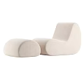 Modern Leisure Chair With Rounded Beige Fabric Design And Matching Ottoman