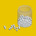 Elegant White Pearl Jewelry In Transparent Glass Jar With Scattered Pearls On Dark Background