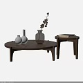 Modern Round Walnut Wood Coffee Table With White Vases Dried Branches And Books