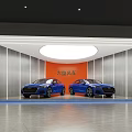 Two Blue Luxury Cars Displayed In Modern Showroom With Orange Backdrop
