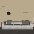 Light Gray Three Seater Sofa With Dark Cushions Arc Floor Lamp And Side Table