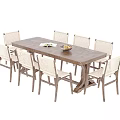 Natural Style Rectangular Wooden Dining Table With Eight Woven Seat Chairs And Fruit Bowl